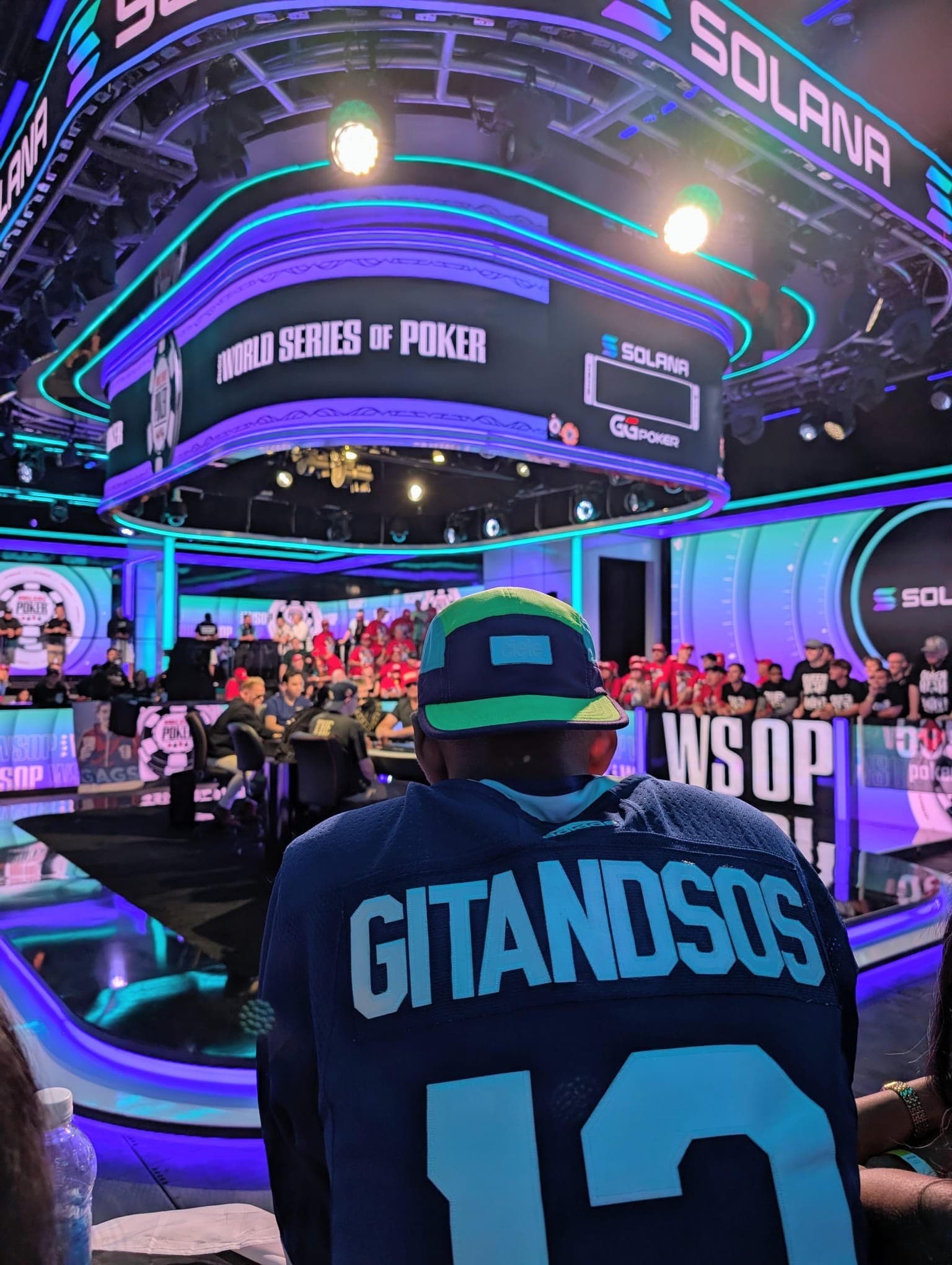 Adam in a GitAndSos jersey facing the World Series of Poker feature table